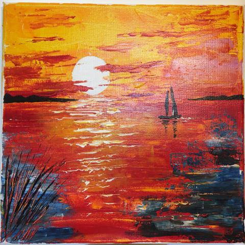 Barchetta sul mare al tramonto