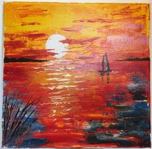 Barchetta sul mare al tramonto
