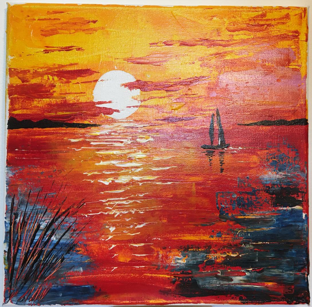 Barchetta sul mare al tramonto