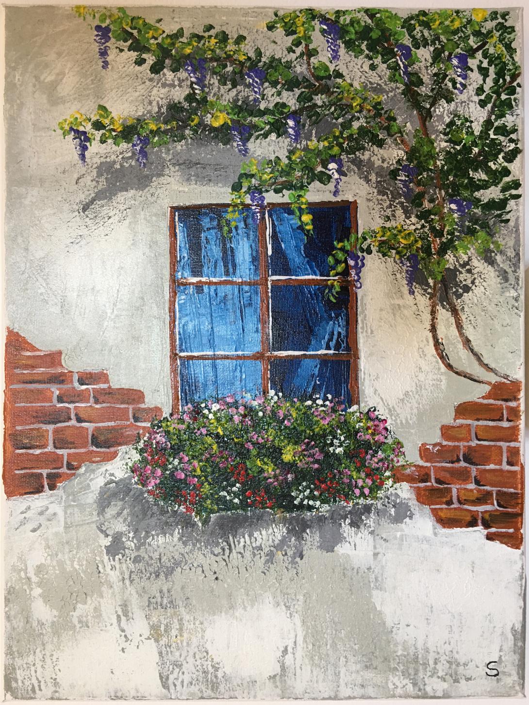 Balcone fiorito sotto il glicine
